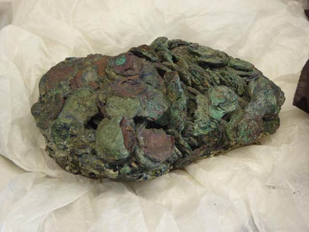 Beachfront, Herculaneum, September 2016. Clump of bronze coins fused together by the heat of the eruption, found on the ancient beachfront, now in deposits. Photo courtesy of Michael Binns.